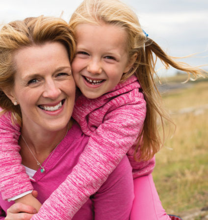 Woman and Daughter Embracing