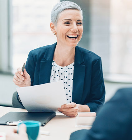 Woman in meeting smiling